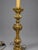 A pair of Continental, probably French, gilt-metal table lamps or electrified candlesticks, late 19th to early 20th...