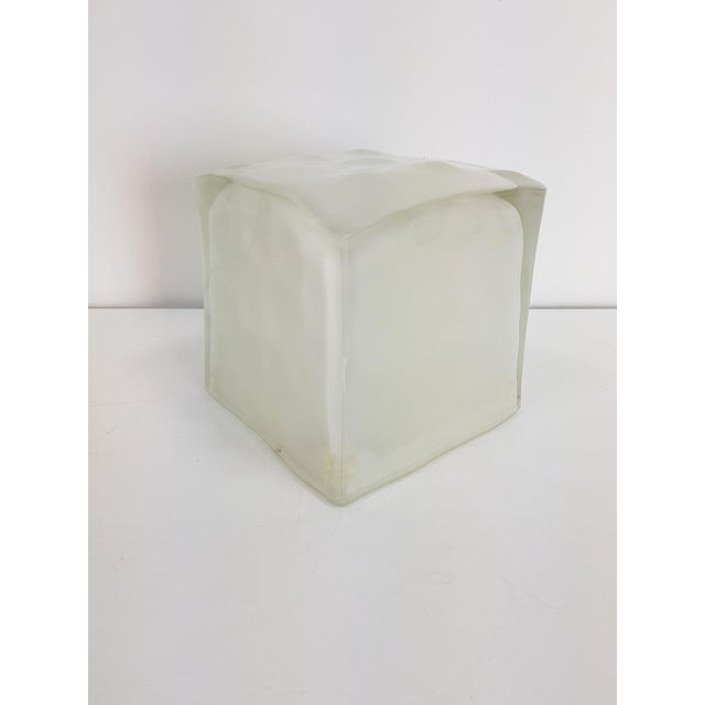 One of Ikea's iconic designs, the `Iviken` lamp known as an ice cube is made of molded glass. It diffuses a soft and...