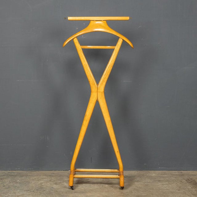 A stylish example of a Fratelli Reguitti wooden suit valet, made in Italy of beech wood this piece has the FR logo stamped...