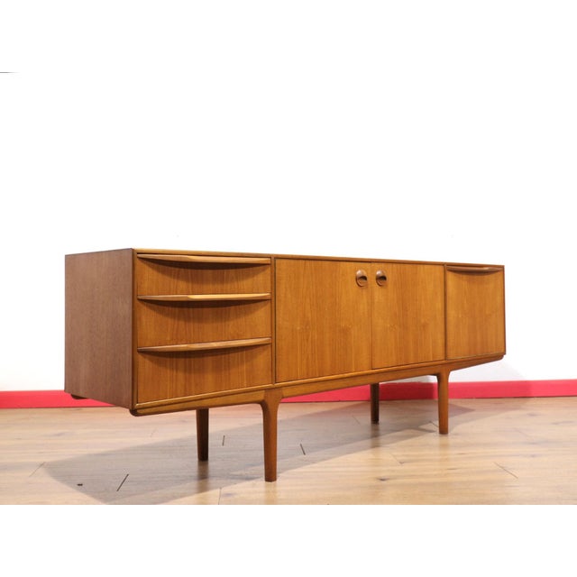 Discover a stunning classic mid-century modern credenza by Scottish furniture maker Mcintosh. This beautifully styled...