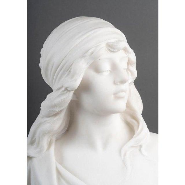 Sculpture of a bust of a young woman in white carrara marble by adolfo cipriani, circa 1900, art nouveau period. H: 59cm,...