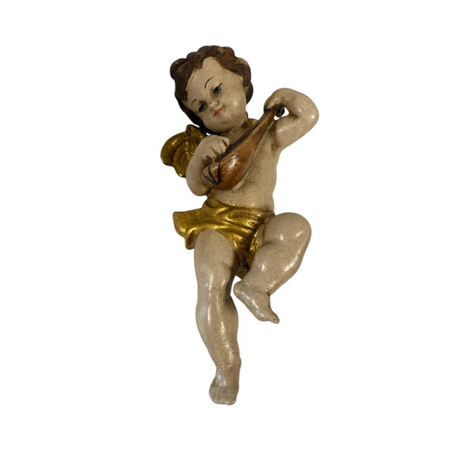 A stunning Italian wooden sculpture of a baroque full-body winged angel playing the mandoline, measuring 7.5 inches.The...