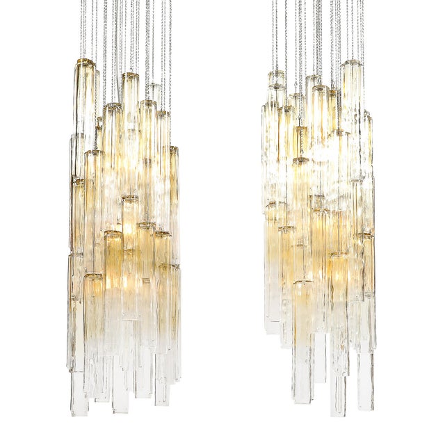 This exquisite pair of chandeliers, crafted in the 1960s by the legendary Venetian glassmakers Venini, represents the...