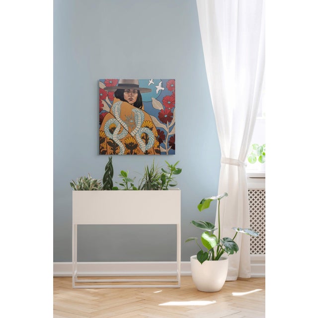 This artwork features a central figure wrapped in a vibrant, patterned shawl adorned with serpents and floral motifs, set...