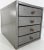 We are offering a small industrial metal box from the midcentury era. It feature four drawers with some partitions. Knobs...