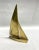 A large solid brass sailboat, perfect for beach house or mid-century modern decor. Bookshelf ready with lovely patina.
