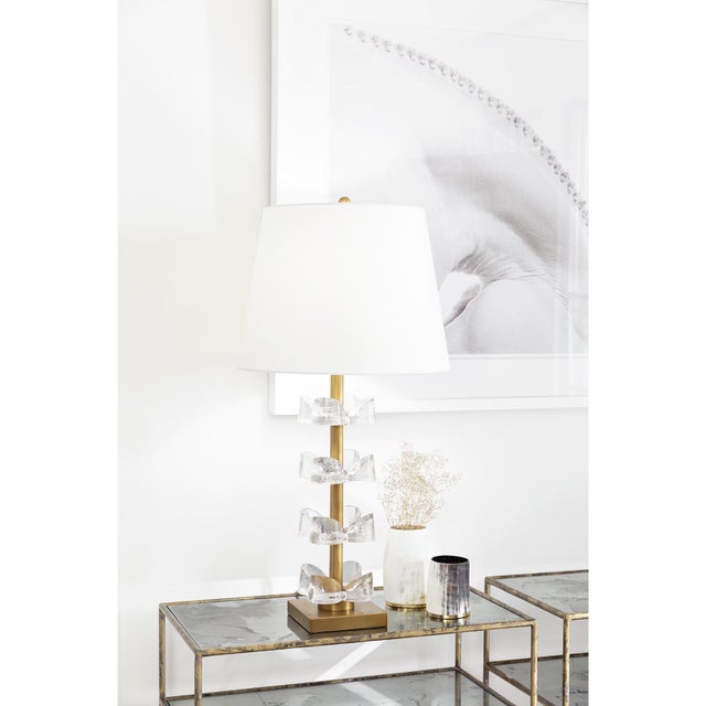 Feminine and fun, the Bella Table Lamp showcases tiers of hand-crafted cast glass flowers gracefully suspended along a...