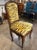 This 18th century French Provincial carved walnut side chair is a beautifully crafted piece of furniture designed for...