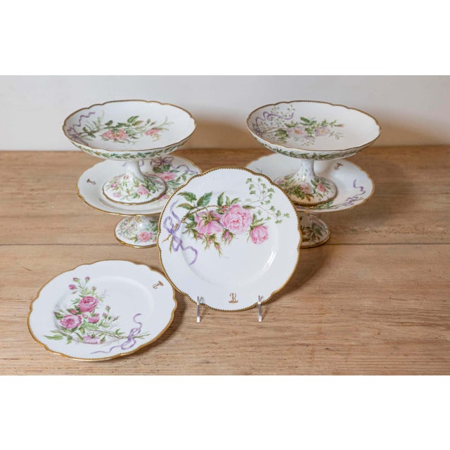 English porcelain compotes and plates from the 20th century, with floral décor and gilded trim, priced and sold...