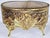The Golden Era comes alive with this 1930-40s 23k gold plated ormolu brass filigree jewelry box with beveled amber glass...