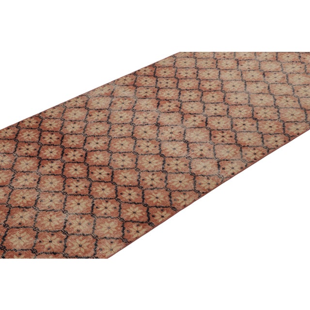 This vintage runner rug is a 3x10 Turkish distressed piece, made with hand-knotted wool circa mid-20th century. It is an...