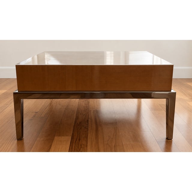 High-end, custom-made coffee table crafted from natural solid wood with a stainless steel finish. Originally commissioned...