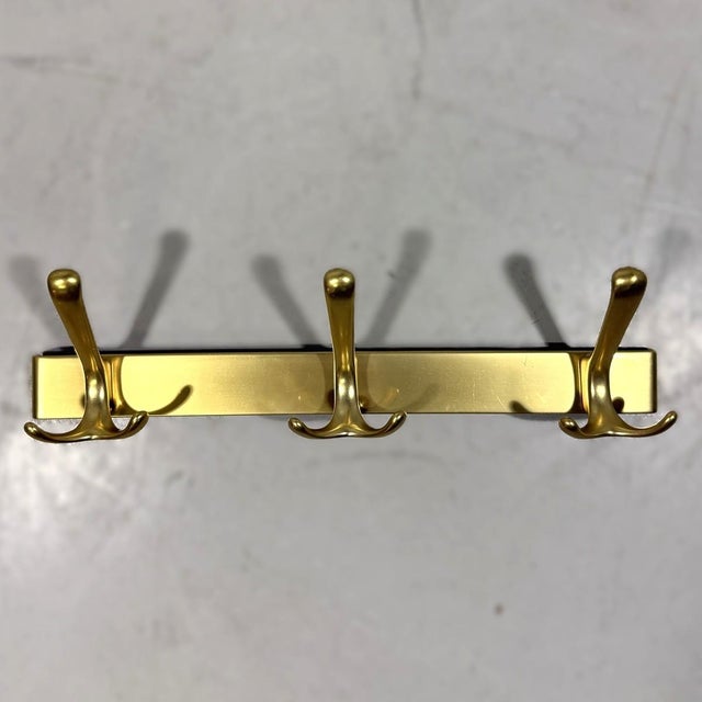 Wall coat racks. Gold coloured aluminium frame with 3 X 3 hooks.