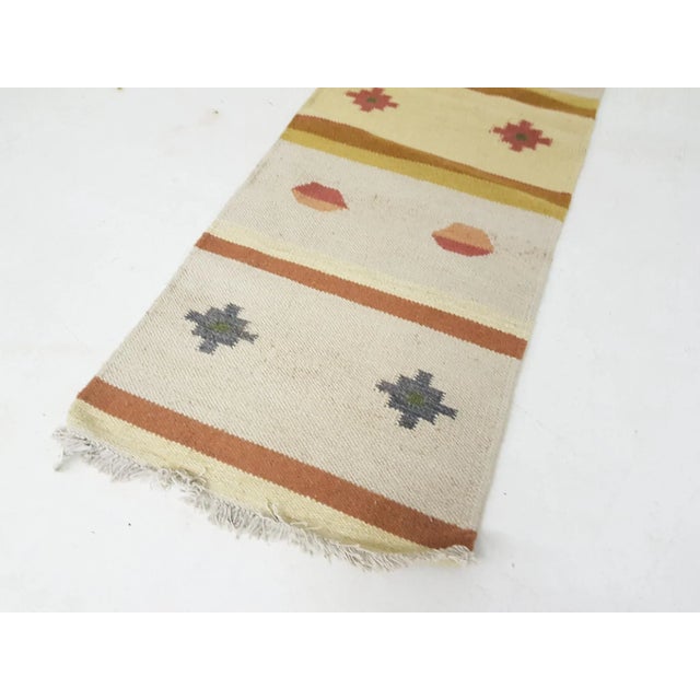 Vintage Indian Woolen Rug, in Good conditions. Designed 1950 to 1959 This piece is attributed to the mentioned...