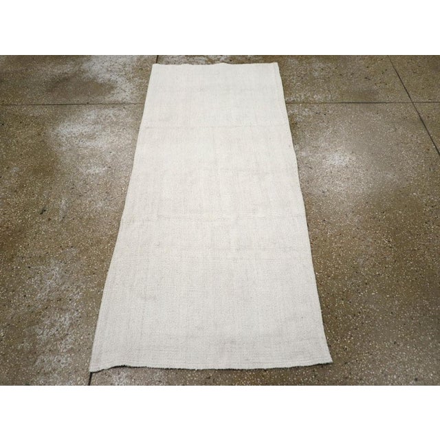 A vintage Turkish flatweave Kilim throw rug handmade during the mid-20th century. Measures: 2' 6" x 5' 9"