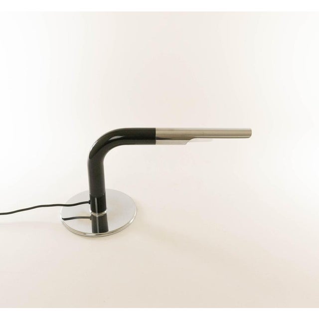 Gulp table lamp designed by Ingo Maurer and produced by his own company Design M. The tubular shaped lamp was designed in...