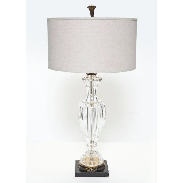 Stunning European crystal table lamp attributed to Waterford, with ebony & brass base. Ebony finial is included.