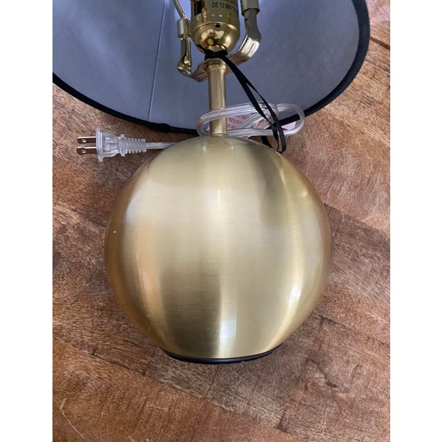Absolutely darling little pair of Kate Spade “bubble” lamps in neutral brushed gold with original black fabric shades....