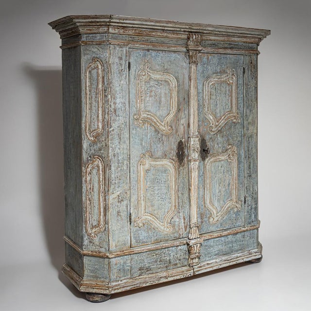 Light blue painted provincial softwood wardrobe with two doors, chamfered corners, and a boldly projecting, richly molded...