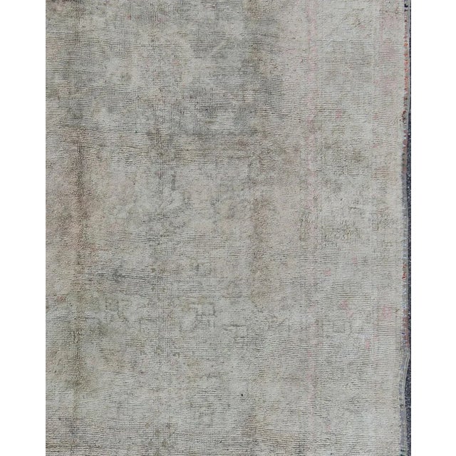 Muted vintage Turkish Oushak rug with central medallion in gray, ivory, brown, rug na-74312, country of origin / type:...