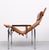 This Lounge chair by Hans Eichenberger has a high quality chrome plated tubular base and a two tone brown leather...