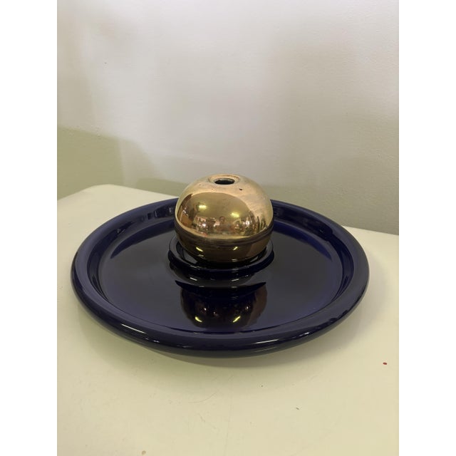Modular centerpiece/vase composed of a large circular plate with a central recess in cobalt blue glazed ceramic and a...