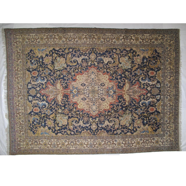 Wool pile hand woven Vintage Persian Tabriz carpet in excellent condition. Navy/gold color.