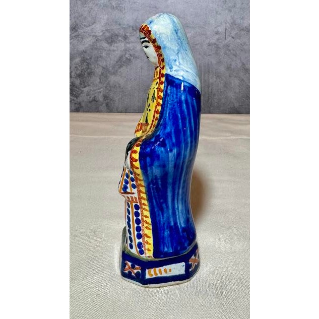 An exquisite mid-century example of authentic hand-painted French faience pottery from the legendary Henriot Quimper...