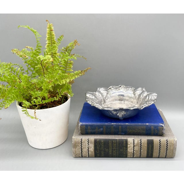 Charming, Arthur Court wine coaster made in 1997 of cast aluminum. Features three elephant heads connected with cutout...