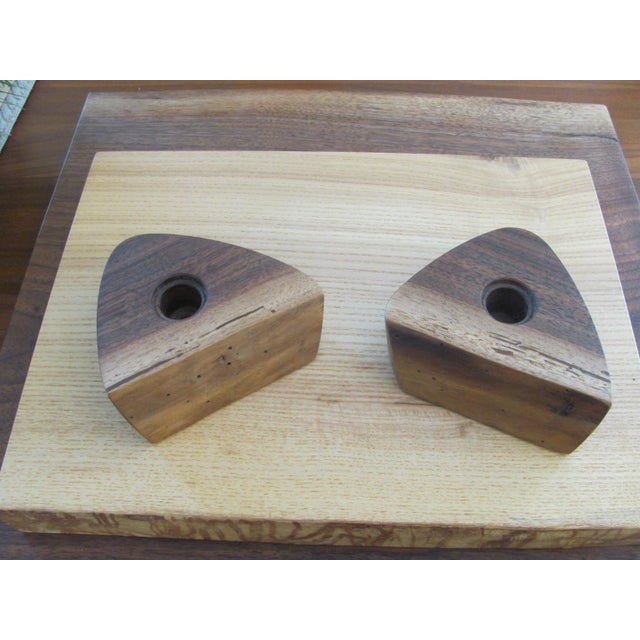 Very fine pair of candleholders from the George Nakashima Studio designed by his daughter Mira Nakashima. The...