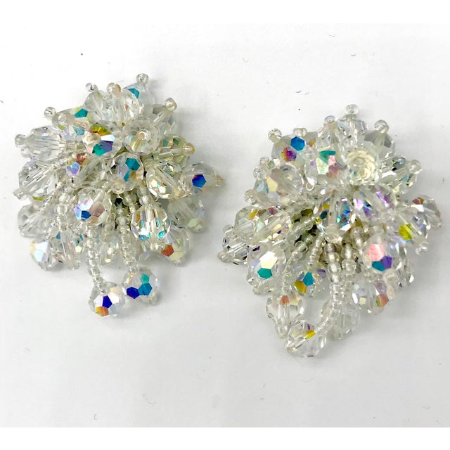 This is part of Chairish’s Costume Jewelry assortment. There is something very Go Go about this pair. These earrings are...