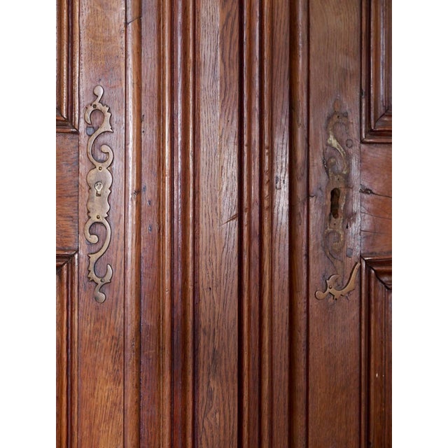 Gorgeous 18th century antique French Grande Louis XIV oak corner cabinet. This antique oversized oak corner cabinet mimics...