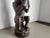 Superb antique carved wooden sculpture depicting a seated, horned figure holding a vessel. Origin: West Africa (Inspired...