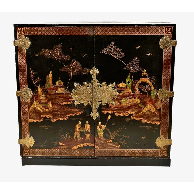 This is a stunning Chinoiserie (Japanned) Cabinet-On-Stand that dates to c. 1950-1960. Note the gorgeous highly detailed...