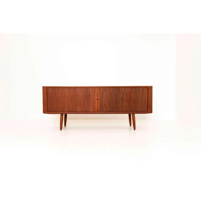Impressive Danish sideboard in teak by Bruno Hansen. This Sideboard has tambour doors with four colored drawers. Although,...