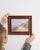 This early 20th century drawing from France is a pastel, housed in a wood and glass frame. Its signed detailing gives the...