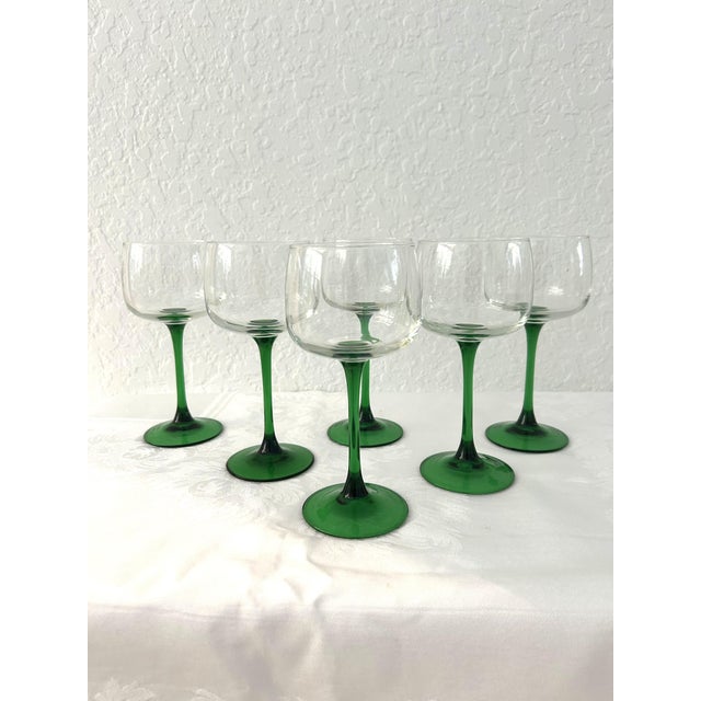 Lovely set of twelve vintage wine glasses featuring Emerald green stems with clear bowls in Luminarc's Alsace pattern. Set...