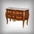 This magnificent commode, typical of the Louis XV style, captivates with the elegance of its flowing lines and the...