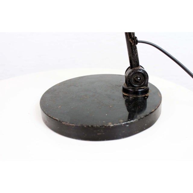 This desk lamp is made of black lacquered metal. Stamped by Maker,This piece has an attribution mark, I am sure that it is...