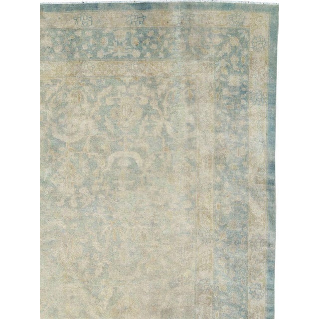 An antique Chinese handmade rug from the early 20th century in shades of seafoam blue and seafoam green. Measures: 9' 11"...