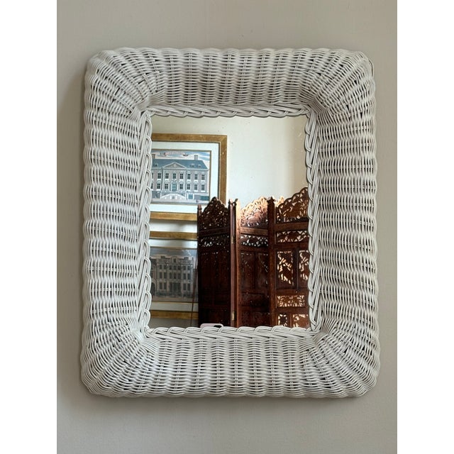 A beautiful mid-20th century white wicker mirror. Love the rectangular shape of this mirror, the deep, thick curves of the...