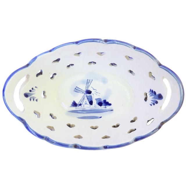 Trio of charming blue & white Delft style pottery pieces; two spice jars (2.75"Dia. x 2.75"H) and a reticulated decrative...