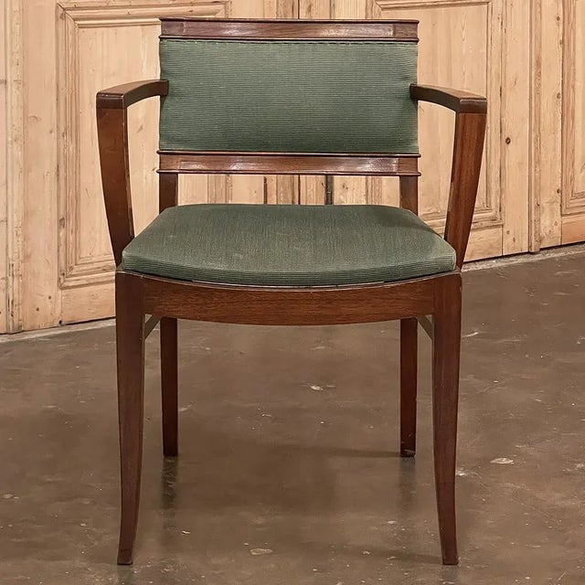 Mid-Century Mahogany Armchair by De Coene is another example of the maker's highest-quality furnishings that made it so...