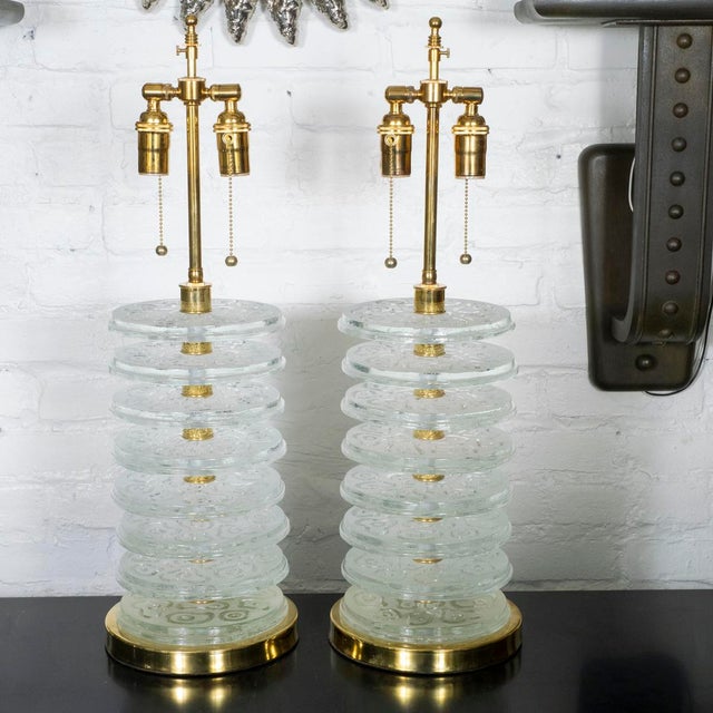 Pair of table lamps composed of stacked, molded and frosted Murano glass disks.