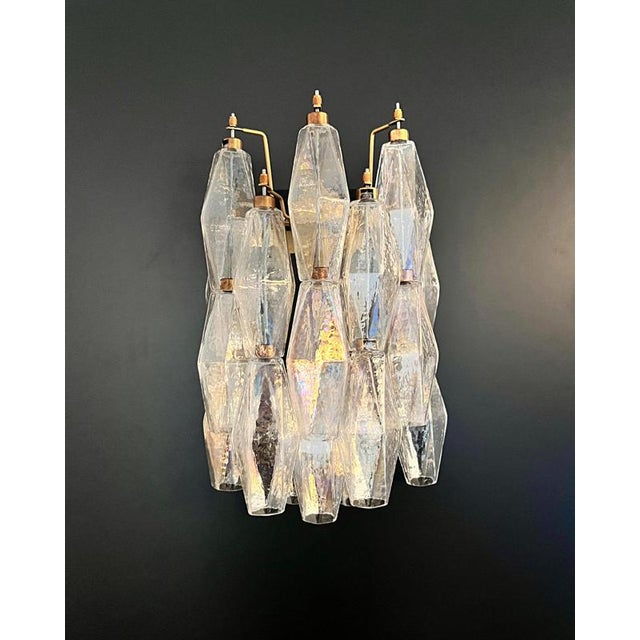 100% handmade in Murano. The sconces are made by 16 Murano handmade Poliedri glass, for each one, in a solid metal frame...