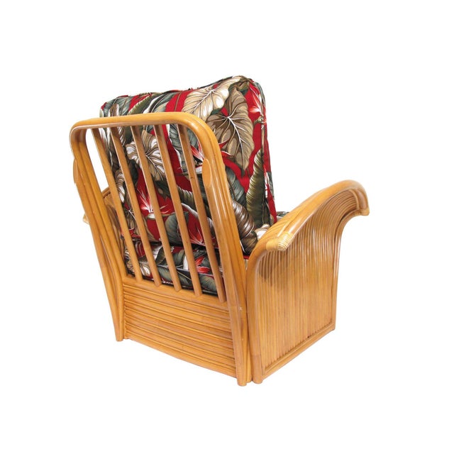 New old stock rattan Art Deco-style lounge chair. The chair features beautifully shaped "Fan" arms with a stacked rattan...