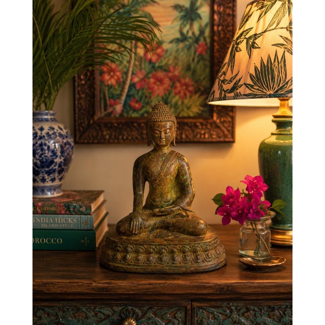An exceptional large antique bronze sculpture depicting Buddha Shakyamuni. Buddha is seated in the full lotus position...