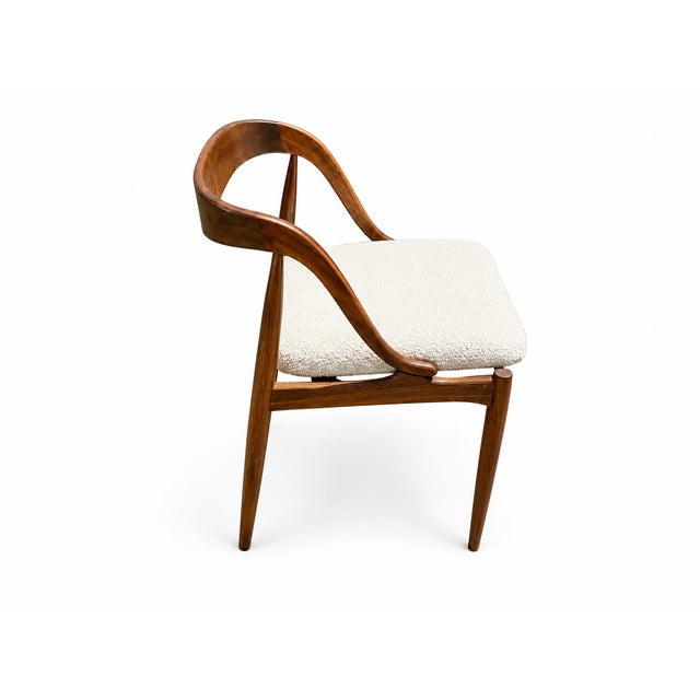 Mid century style solid walnut dining chairs . Fabric is white Boucle. The chairs are made in style of Johannes Andersen ....