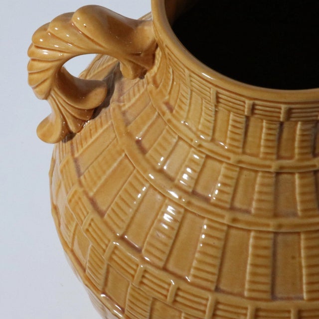 Beautiful pair of glazed ceramic jars depicting a basketweave pattern with ornate handles. Fantastic vintage condition....