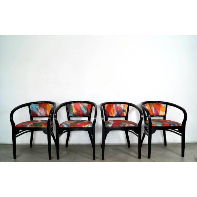 Vintage set of four post modern arm chairs for sale. We can sell them in pairs. They have the original black lacquered...